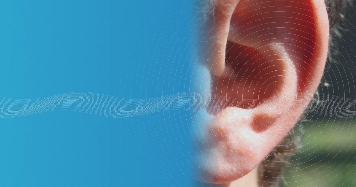 Photo-style close-up of a person's ear with white sound waves on a blue background.